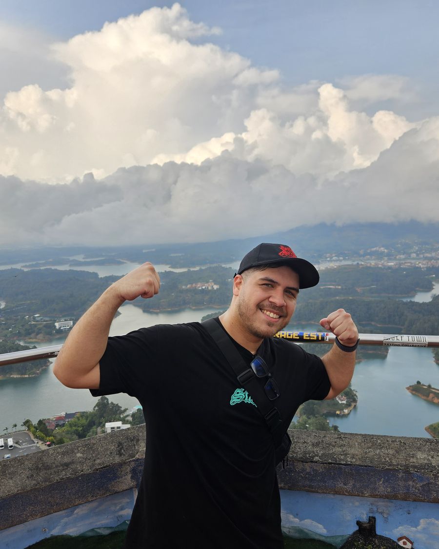 Pablo flexing at a viewpoint over the lakes of Guatapé